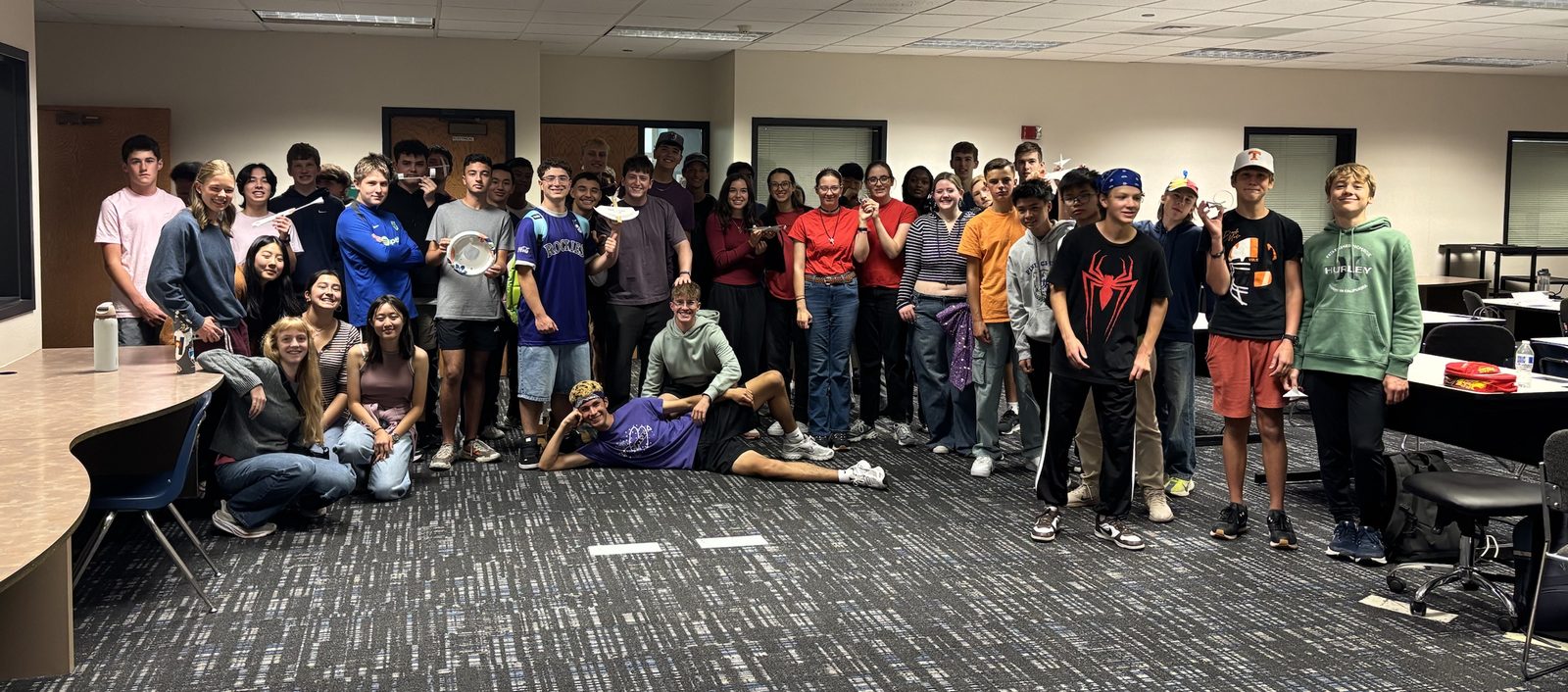 Students at the ABLE Engineering Aerodynamics & Glider Workshop, some holding the gliders they built